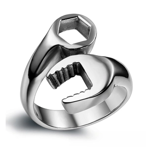 Detailed view of polished stainless steel biker ring with creative wrench tool design