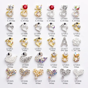 Detailed grid of 30 3D butterfly and animal nail art charms with crystal rhinestones