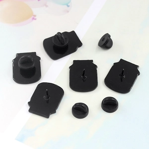 Jar-shaped black enamel fruit pin set with rubber clutches on a decorative background