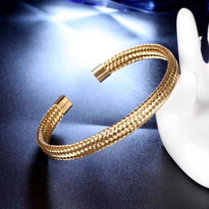 Golden mesh C-shape stainless steel cuff bracelet displayed on a hand stand