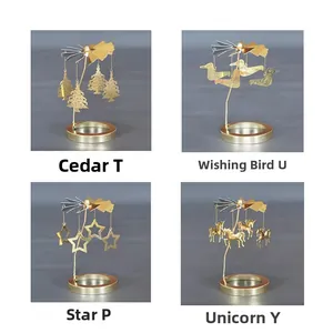 Details von vier goldenen rotierenden Kerzenhaltern: Zeder, Vogel, Stern und Einhorn Motive