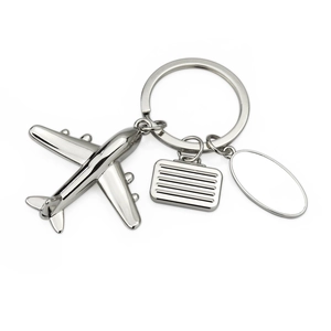 3D model airplane keychain with miniature suitcase and engravable silver metal tag
