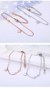 Detailed view of Lucky letter and star charms on adjustable rose gold and silver bracelets
