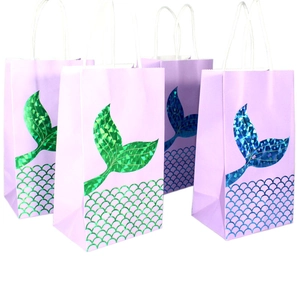 Detail of lavender mermaid paper gift bags with glossy scale patterns and white rope handles