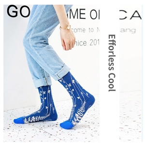 Mid-calf cotton socks in deep blue with white plant leaf patterns and reinforced toes