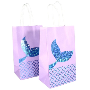 Detail of light purple mermaid gift bags with holographic foil tails and scale pattern