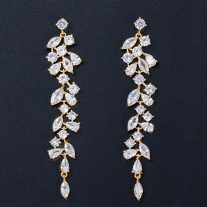 Detailed view of long petal tassel earrings with white zircon and gold base