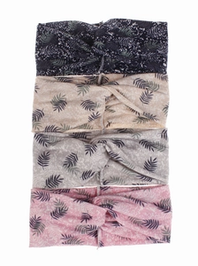 Detail view of 4-pack elastic twisted headbands with tropical green leaf prints