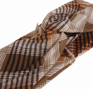 Detail of brown and white plaid headband featuring a stylish central knot design