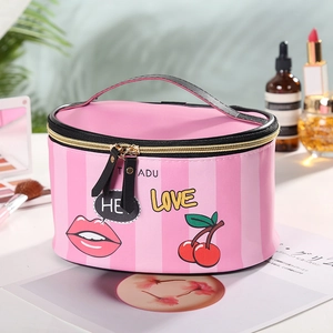 Pink and black striped PU makeup bag with top handle and cherry lip patterns