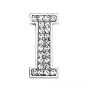 Macro shot of silver chrome letter I charm with inlaid rhinestones for DIY bracelets