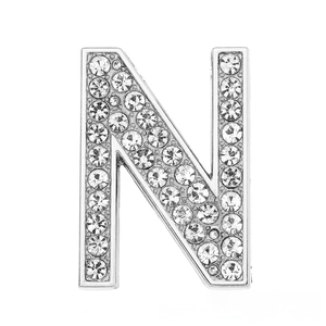 Detailed close-up of a silver rhinestone-paved letter N charm for DIY bracelets