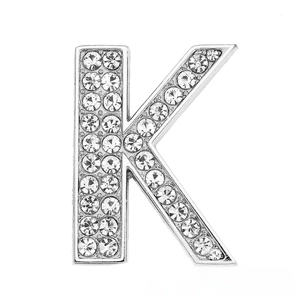 Macro view of silver alphabet K charm with pavé setting rhinestones for DIY jewelry