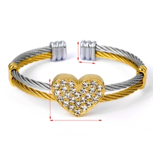 Detail view of two-tone cable bracelet with crystal heart charm and size measurements