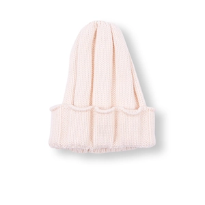 Close-up detail of soft cream-colored ribbed knit beanie hat for infants and toddlers