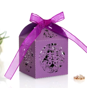 Detailed shot of purple laser-cut candy box with traditional Chinese Double Happiness motif