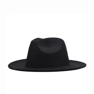 Detailed view of black wool felt fedora with flat brim and structured pinched crown