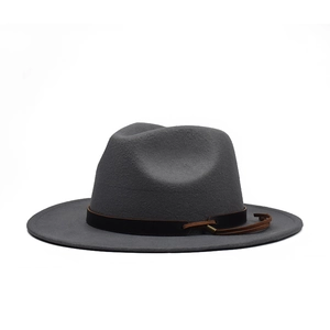 Detailed close-up of dark grey wool fedora hat with decorative black and brown bands