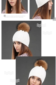 Detail view of white cable knit beanie with a fluffy dark brown pom-pom for winter