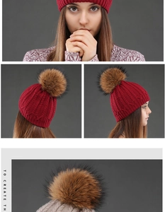 Detail of cable knit texture and faux fur pom pom on a winter beanie for women