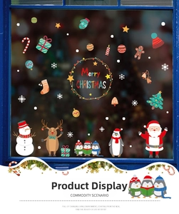 Detail of Christmas window decals featuring Santa, snowman and reindeer on glass