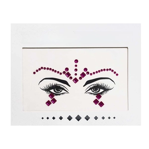 Close-up of magenta face crystal stickers and rhinestones in professional white packaging