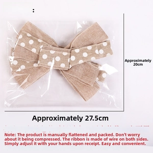 Linen Christmas bow with white polka dots in transparent packaging, 20cm x 27.5cm size