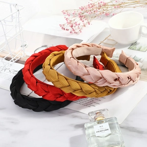 Satin braided headbands set in black, red, yellow and pink on a stylish marble background