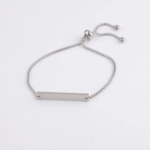 Detailed view of silver bar bracelet with adjustable sliding box chain and mirror finish
