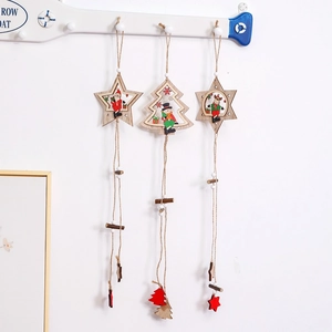 Handcrafted wooden Christmas tree ornaments with Santa and Reindeer on a white wall