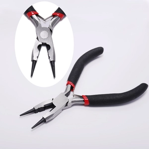 Macro detail of professional round nose jewelry pliers with red and black anti-slip handle