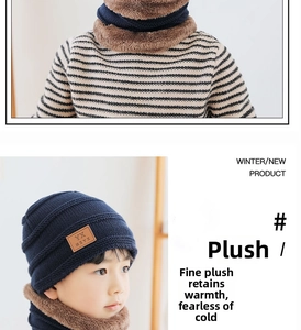 Close-up of winter knit hat and neck warmer with thick brown fleece lining in navy blue