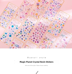 Detailed view of 3D crystal epoxy stickers with gold foil edges in various themes