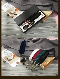 Vintage feather quill pen set with engraved barrel and ink in luxury gift box