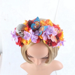 Detailed close-up of a festive headband featuring colorful faux flowers and butterfly accents