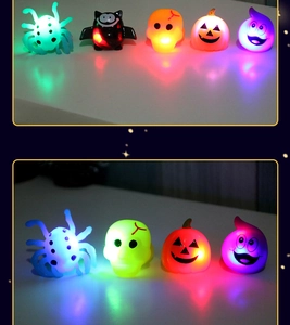 Macro view of glowing Halloween rings featuring pumpkin, bat and ghost icons