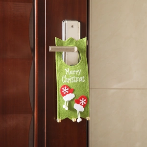 Green felt Christmas door hanger with Merry Christmas text and golden bells on wood handle