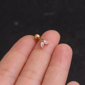 Golden marquise zircon stainless steel stud earring shown on a finger for size