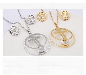 Detailed view of stainless steel cross necklace and earrings set with zircon stones