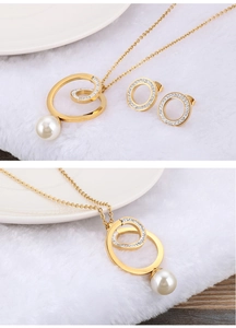 Detail of gold hollow circle jewelry set with sparkling rhinestones and white pearls