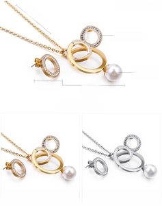 Detail view of steel geometric circle set with zircon stones and shell pearl charms