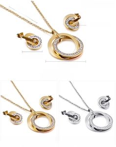 Detail of interlocking double ring necklace and earrings with zircon in gold and steel