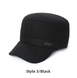 Detail view of black wool military cap featuring a side metal logo badge and thick fabric