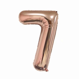 Detail of a large number 7 rose gold foil balloon for birthday party decorations