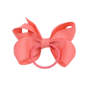 Coral pink grosgrain ribbon bow hair tie for girls with elastic band on white background