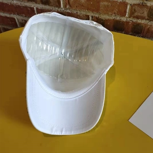 Close-up of white baseball cap brim and interior structure with protective shape support