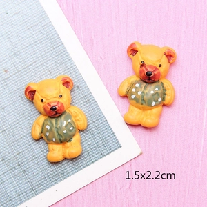 Detail of DIY resin bear accessories in yellow with green polka dot vest 1.5x2.2cm