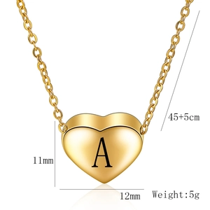 Detail of heart pendant with letter A engraving and size dimensions displayed on white background