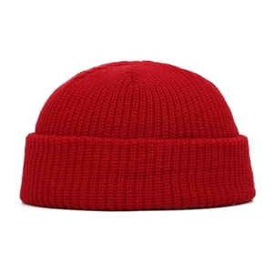 Detailed close-up of the red vertical ribbed texture on this warm winter knit beanie hat