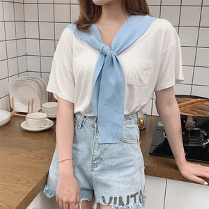 Women's knit shawl scarf with white pocket t-shirt and light blue denim shorts outfit